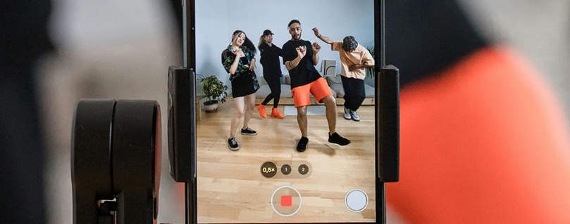 Creator recording a dance challenge with smartphone — image via Pexels